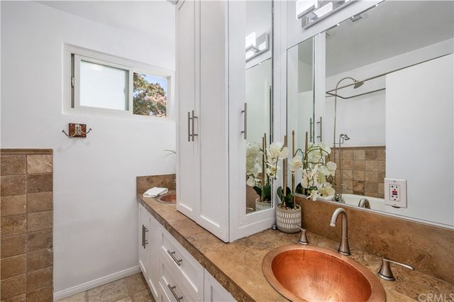 a bathroom with a white bath tub and a shower