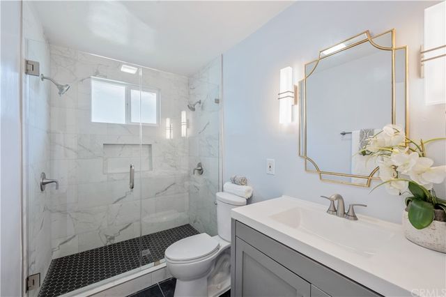 a bedroom with a bed and a table