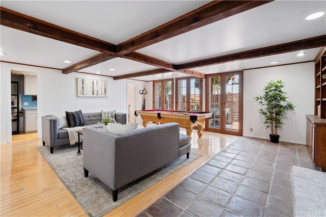a living room with furniture fireplace and flat screen tv