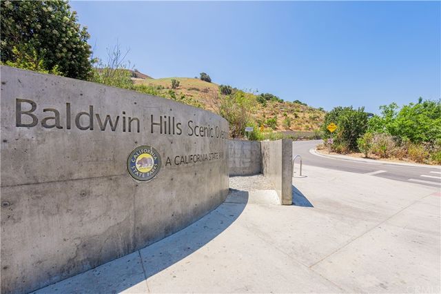 a view of a fountain in front of a house
