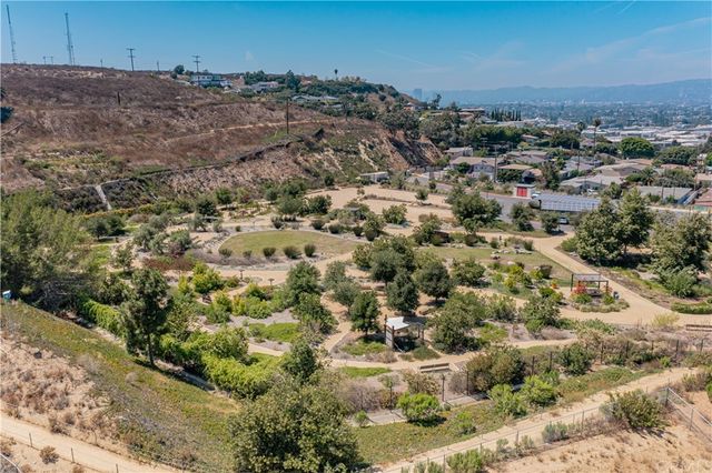 a view of a street with a building in the background