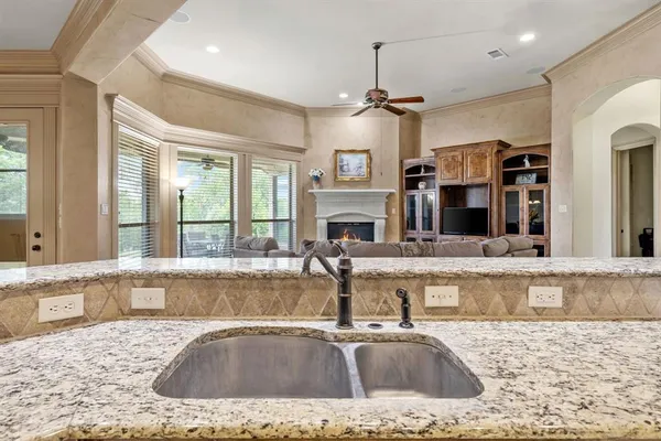 a kitchen with stainless steel appliances granite countertop a sink and a cabinets