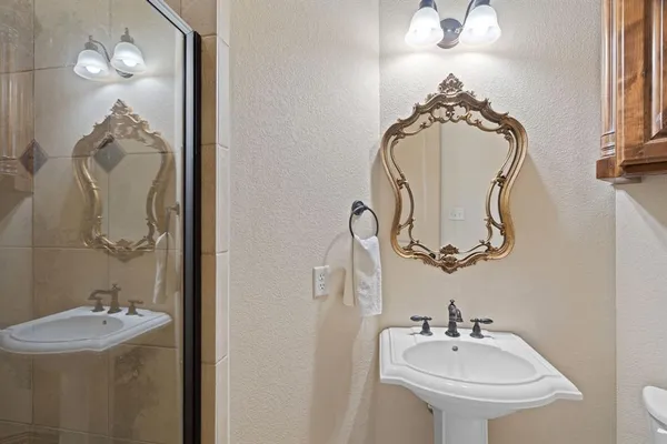 a bathroom with a sink and mirror