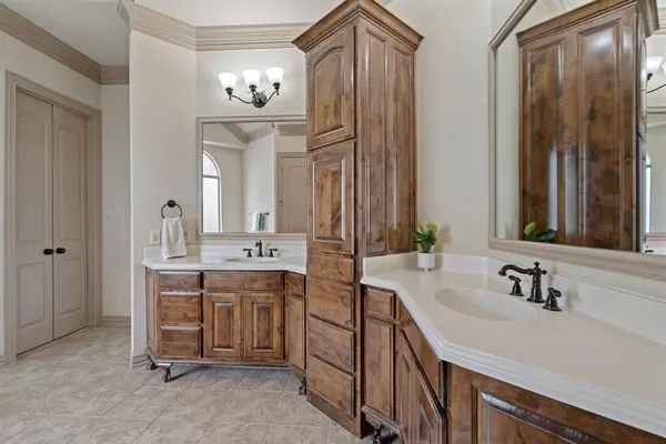 a bathroom with a sink double vanity and a mirror