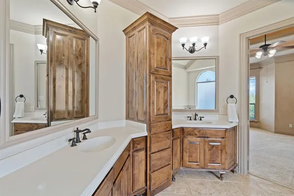a bathroom with a double vanity sink mirror and