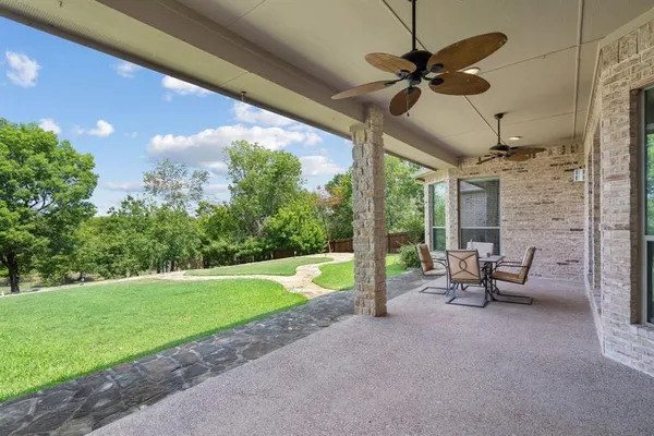 a view of a patio with a backyard