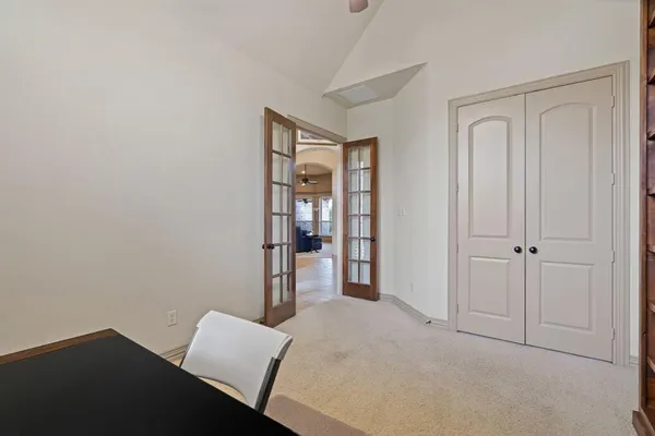 a view of room with window and hallway
