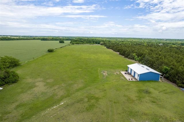 a view of a lake with houses in the back
