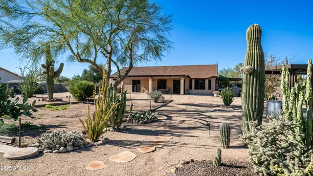 a view of a backyard with sitting area