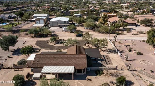 an aerial view of residential houses with city view
