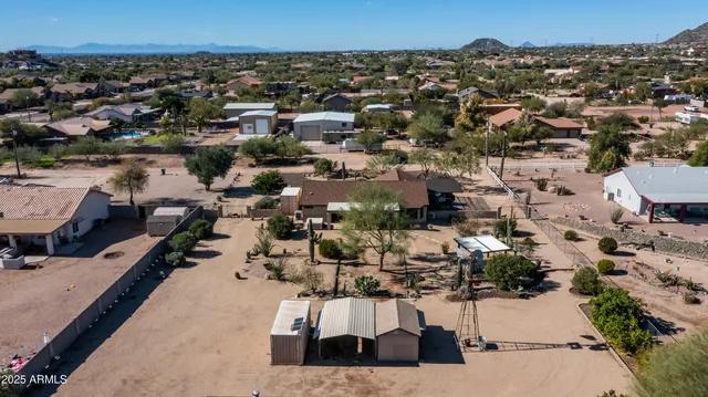 an aerial view of residential houses with outdoor space