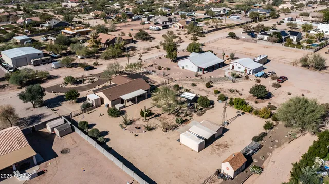 a view of a patio with couches under an umbrella