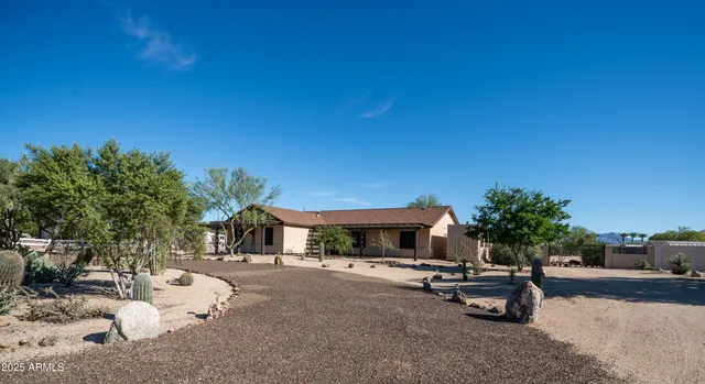 a view of a backyard with a sitting area