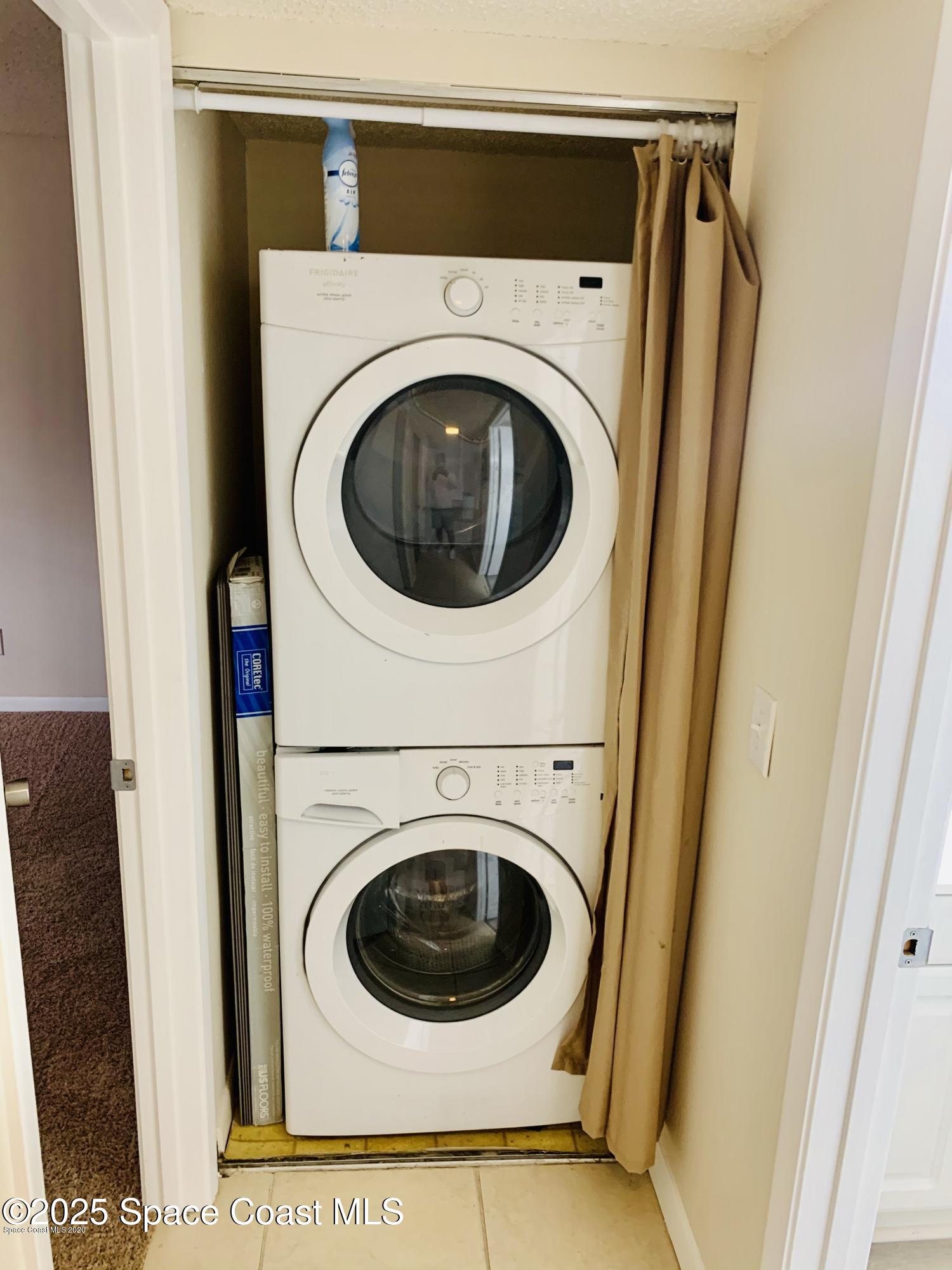 1648 Sunny Brook Lane, Unit M202 Palm Bay, FL 32905 - Photo 13 of 15 a utility room with dryer and washer