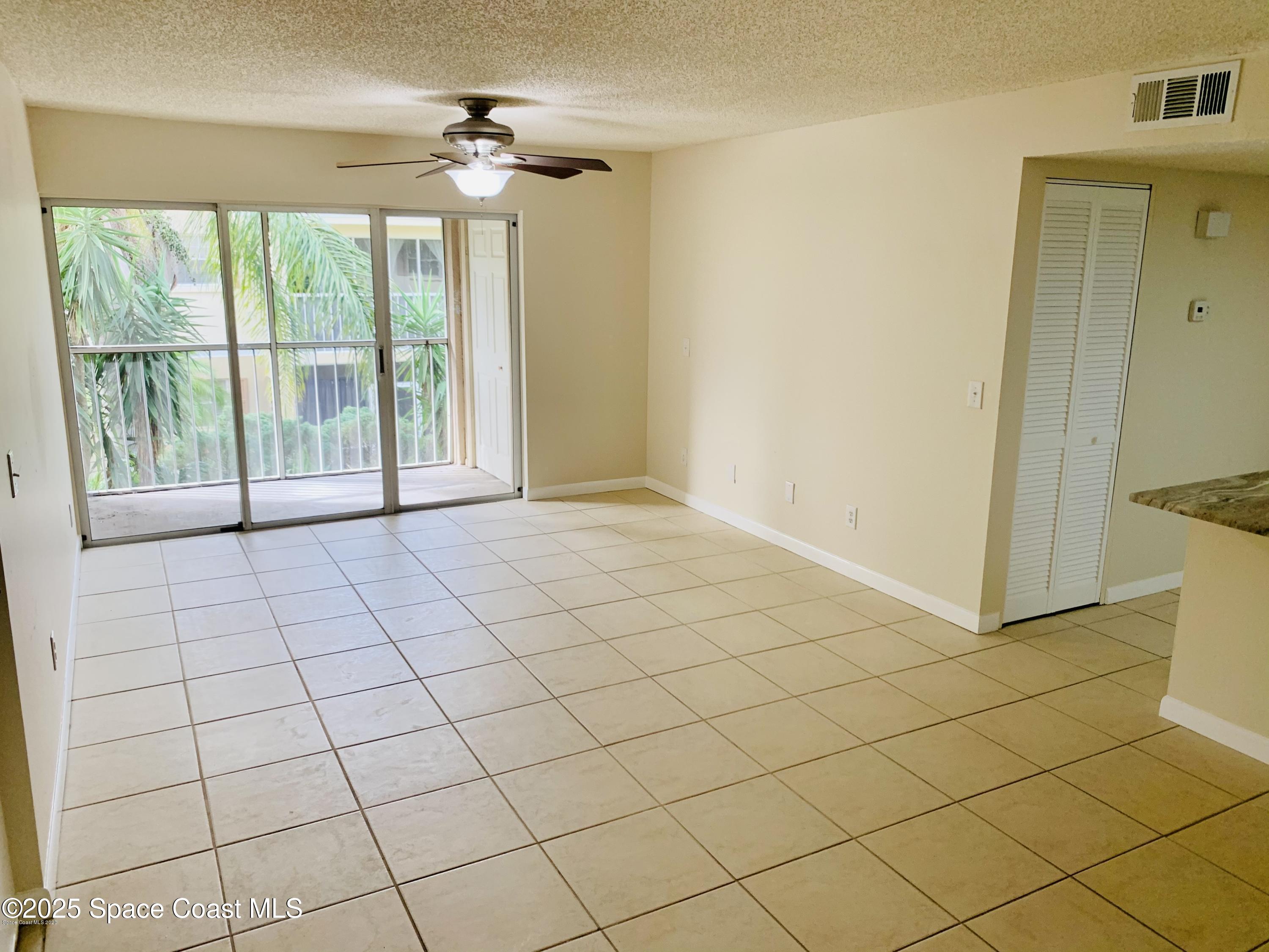1648 Sunny Brook Lane, Unit M202 Palm Bay, FL 32905 - Photo 3 of 15 a view of an empty room and a window