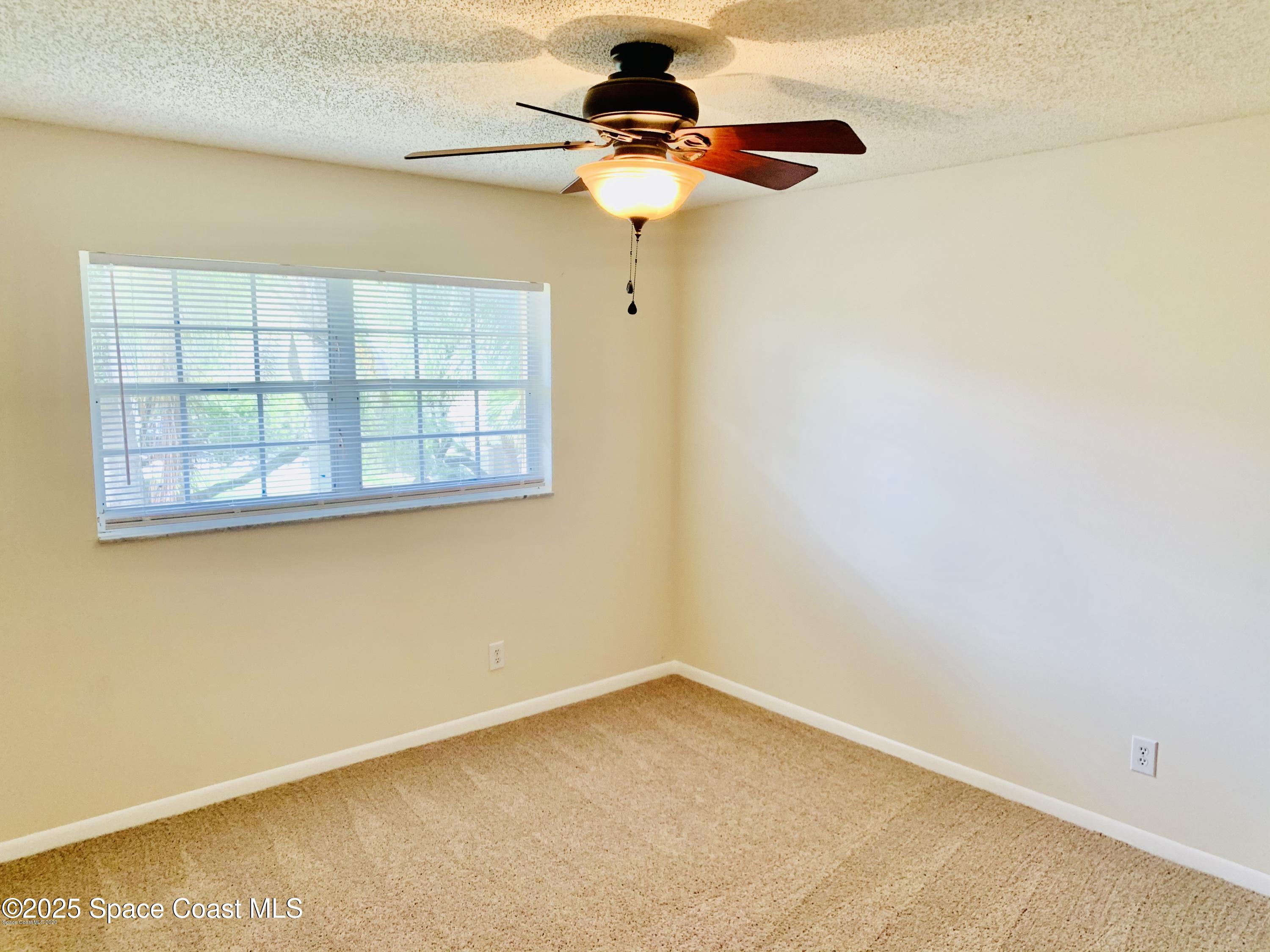 1648 Sunny Brook Lane, Unit M202 Palm Bay, FL 32905 - Photo 10 of 15 a view of empty room