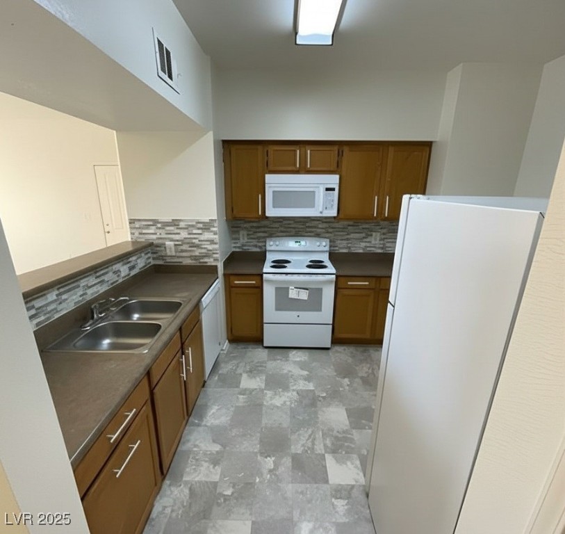 6650 West Warm Springs Road, Unit 1024 Las Vegas, NV 89118 - Photo 6 of 14 Virtually applied kitchen backsplash + cabinet hardware. Will be installed before closing!