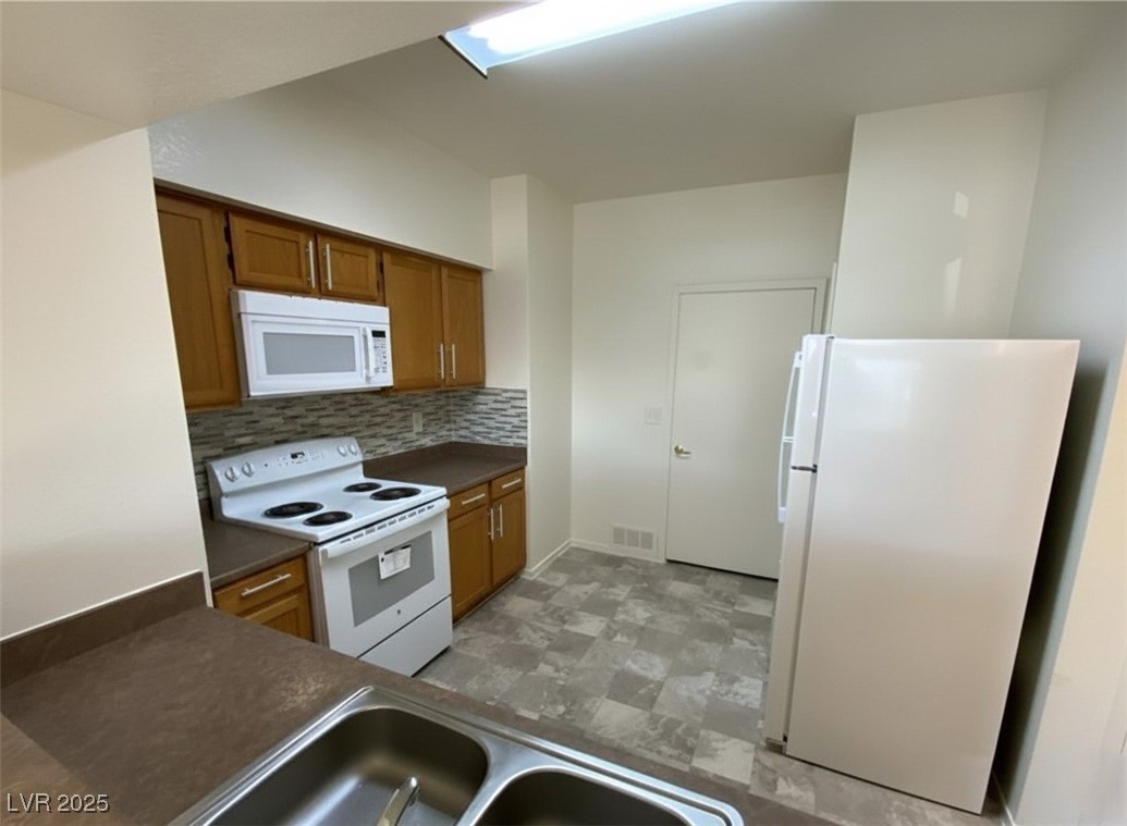 6650 West Warm Springs Road, Unit 1024 Las Vegas, NV 89118 - Photo 7 of 14 Virtually applied kitchen backsplash + cabinet hardware. Will be installed before closing!