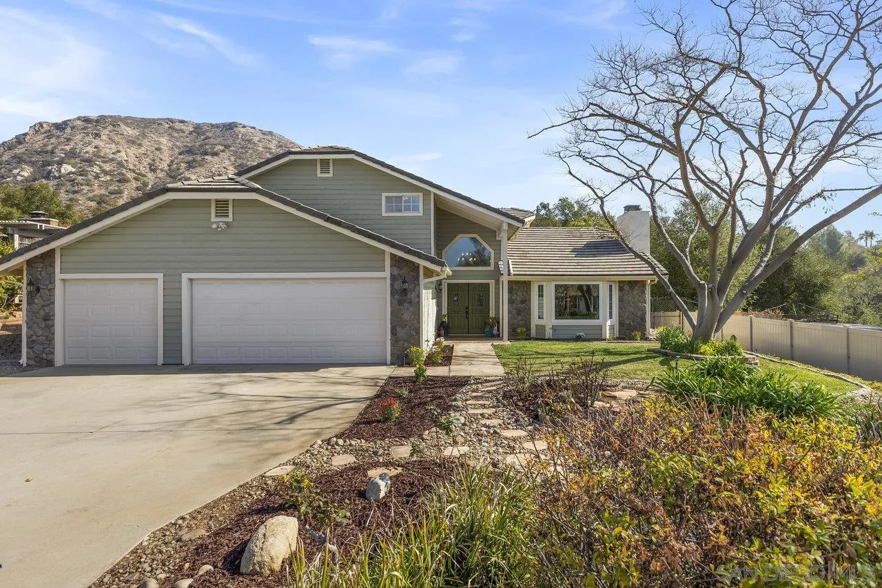 15931 Litten Way Ramona, CA 92065 - Photo 43 of 43 a front view of a house with a garden