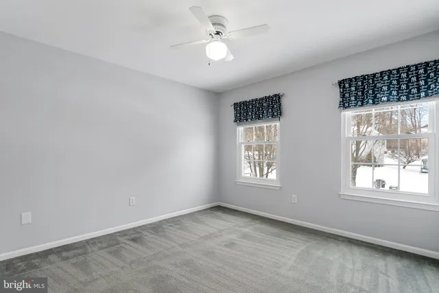 a view of an empty room with stairs