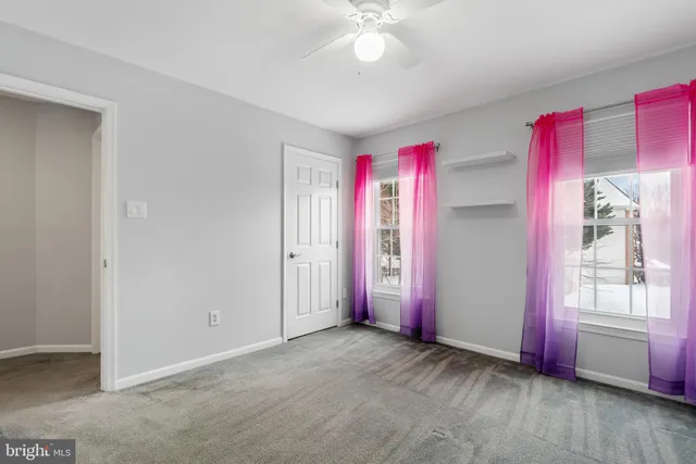 an empty room with shelves