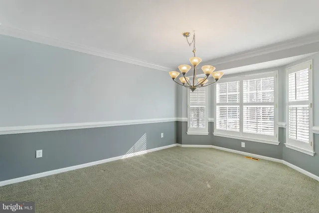 a living room with furniture fireplace and window