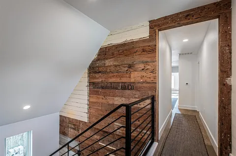 a view of a small house with a yard