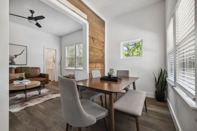 a view of a dining room with furniture window and wooden floor