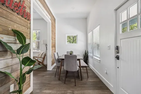 a bedroom with a bed and a night stand