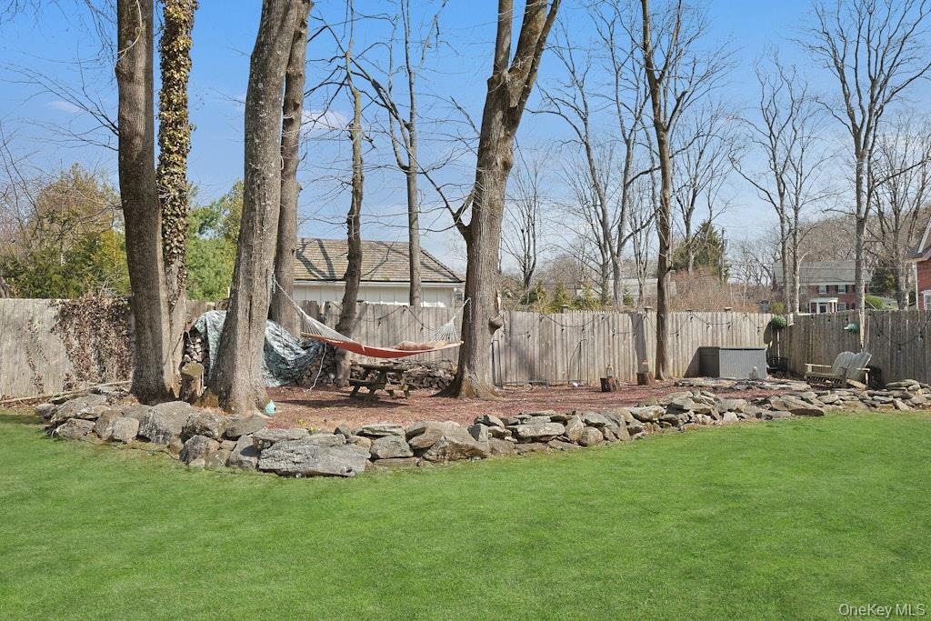 280 Bedford Road Pleasantville, NY 10570 - Photo 36 of 49 a view of a backyard with plants and large trees