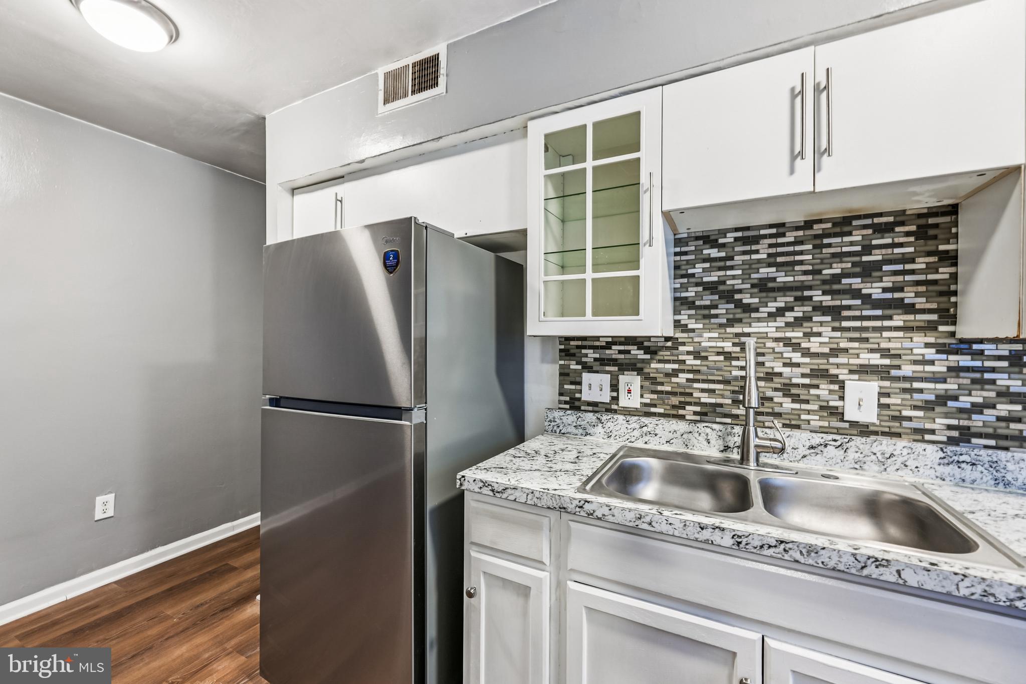 2640 Wade Road Southeast, Unit 2 Washington, DC 20020 - Photo 11 of 23 a kitchen with a refrigerator and a sink