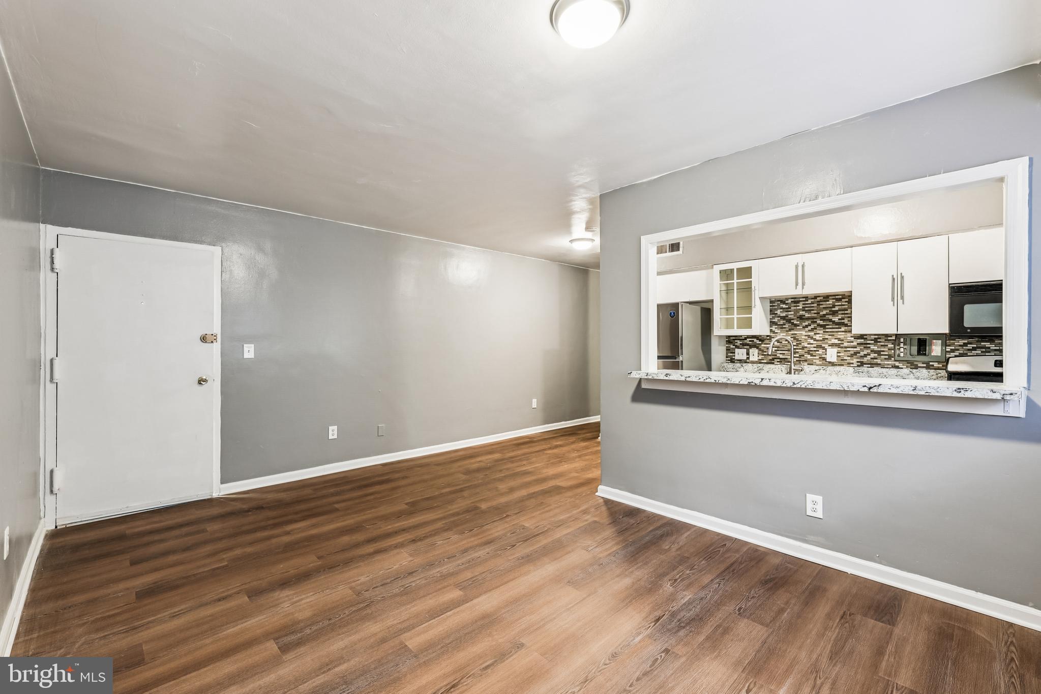 2640 Wade Road Southeast, Unit 2 Washington, DC 20020 - Photo 13 of 23 a view of kitchen with wooden floor and electronic appliances