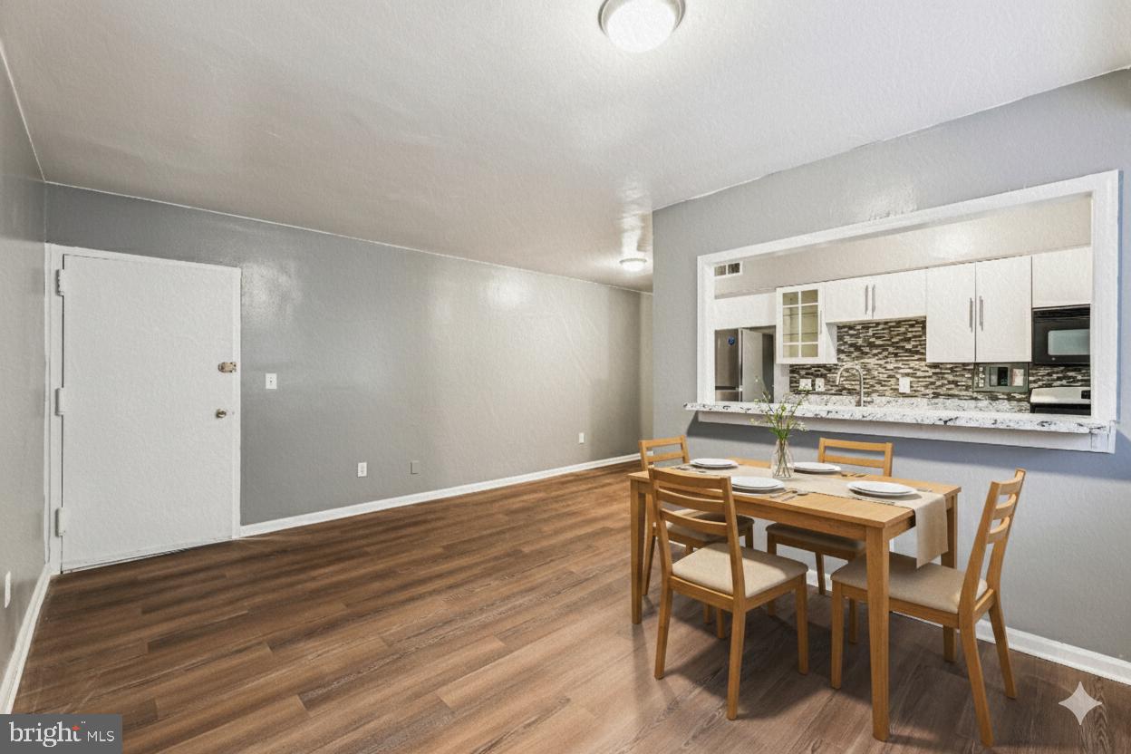 2640 Wade Road Southeast, Unit 2 Washington, DC 20020 - Photo 14 of 23 a view of a dining room with furniture and wooden floor