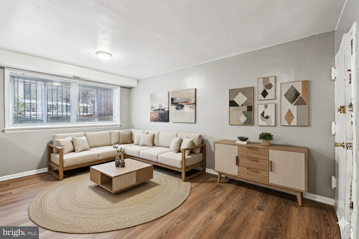 2640 Wade Road Southeast, Unit 2 Washington, DC 20020 - Photo 16 of 23 a living room with furniture and wooden floor