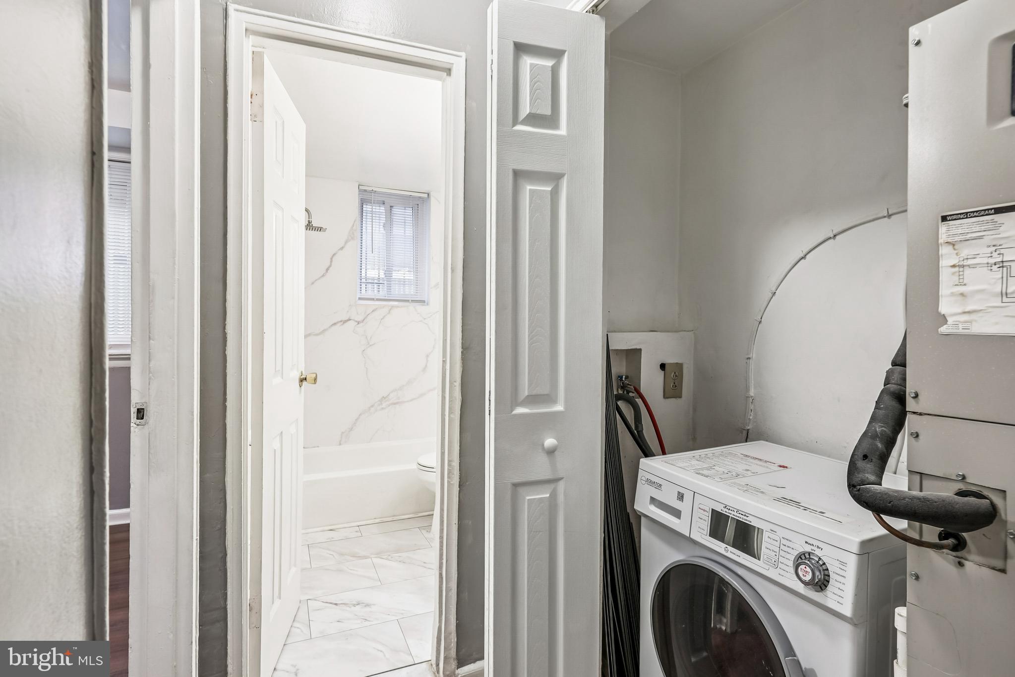 2640 Wade Road Southeast, Unit 2 Washington, DC 20020 - Photo 23 of 23 a view of storage and utility room with washer and dryer