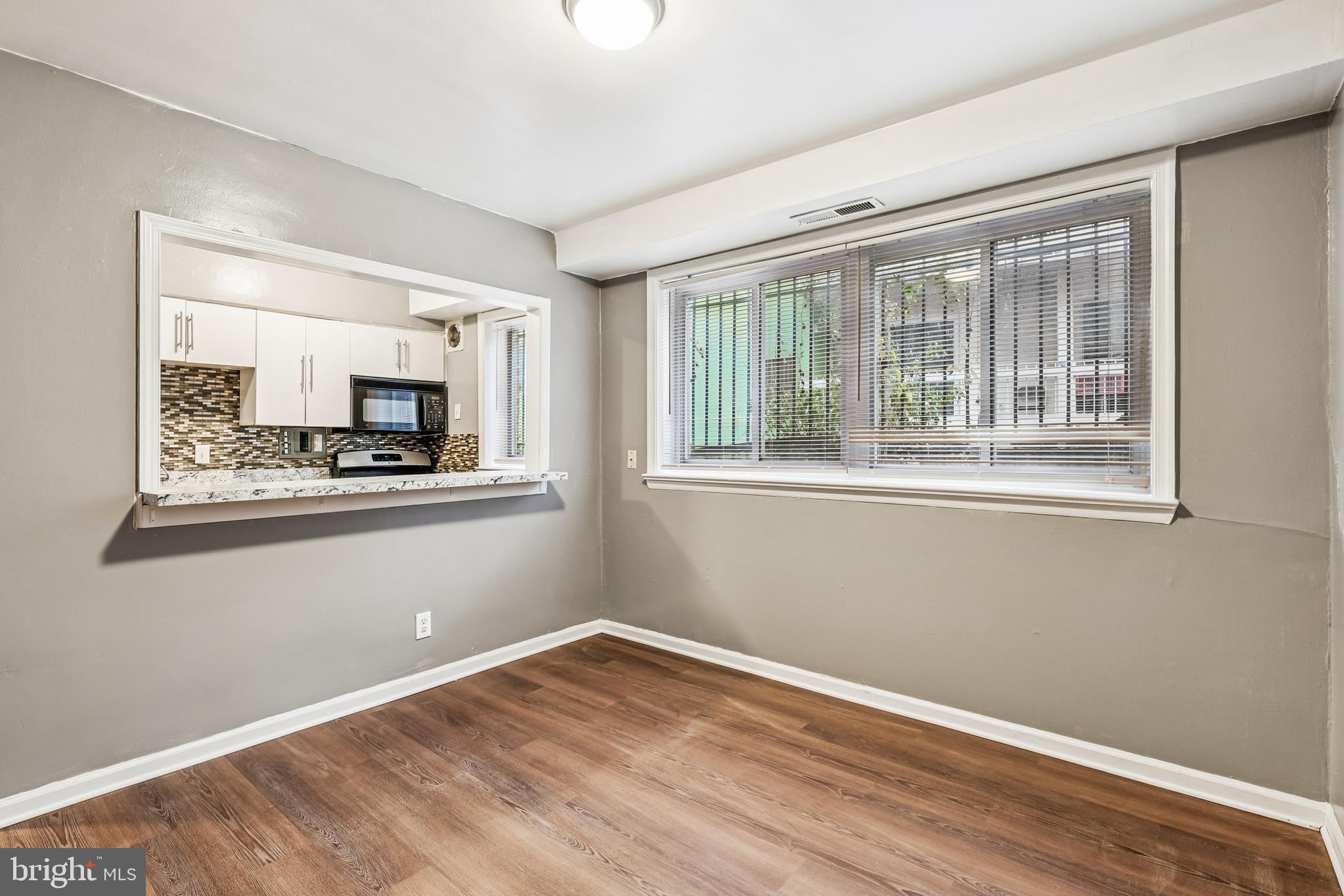 2640 Wade Road Southeast, Unit 2 Washington, DC 20020 - Photo 5 of 23 a view of empty room with wooden floor and fan