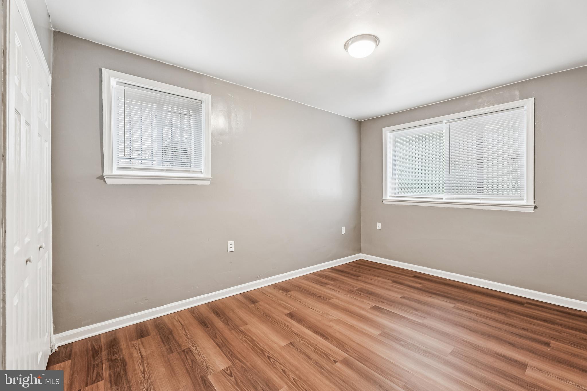 2640 Wade Road Southeast, Unit 2 Washington, DC 20020 - Photo 6 of 23 a view of a room with wooden floor and windows