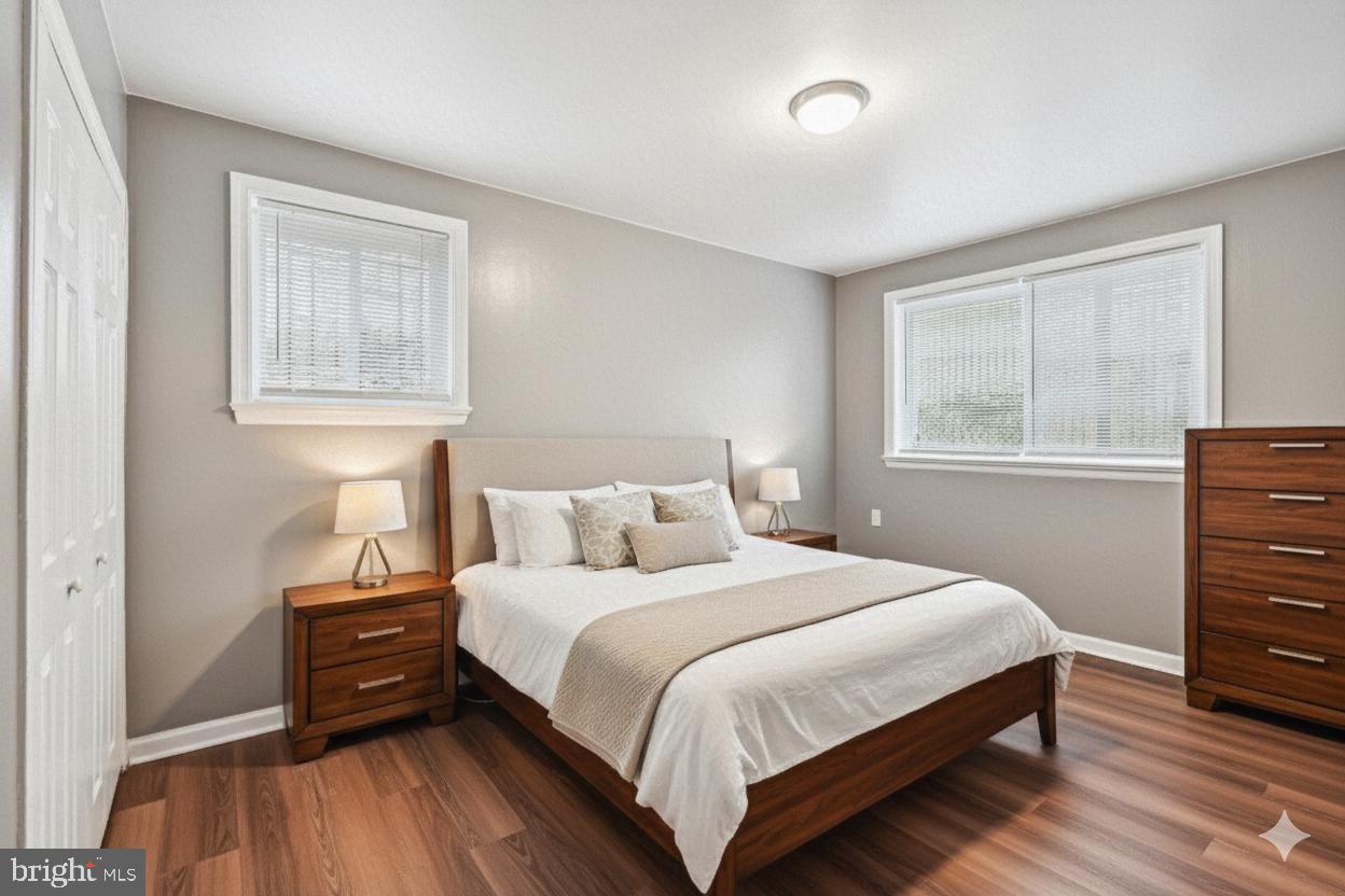 2640 Wade Road Southeast, Unit 2 Washington, DC 20020 - Photo 7 of 23 a bedroom with a bed and wooden floor