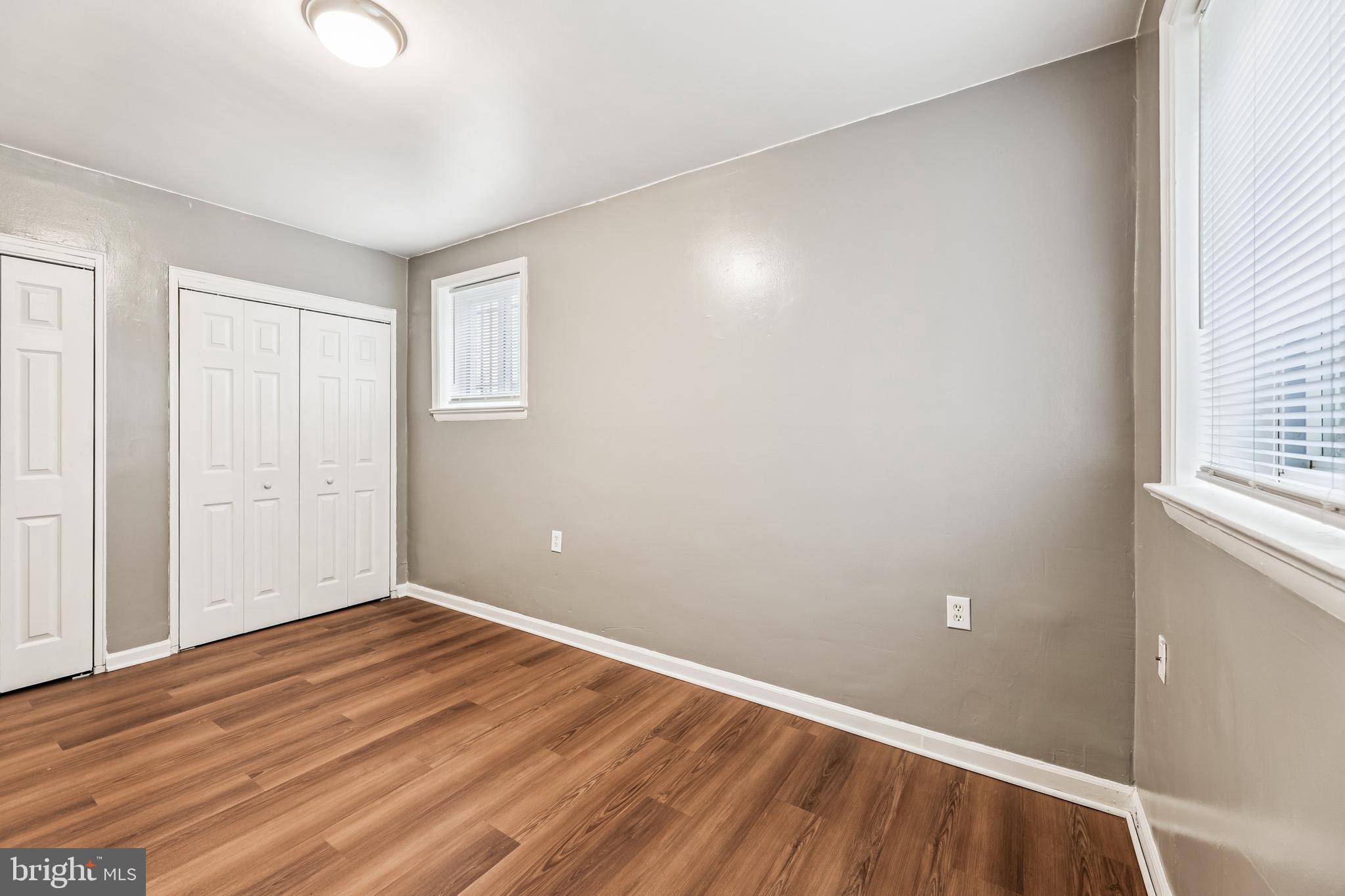 2640 Wade Road Southeast, Unit 2 Washington, DC 20020 - Photo 9 of 23 a view of an empty room with wooden floor and a window