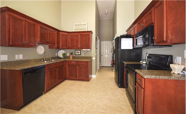 1523 Ripken Court Murfreesboro, TN 37129 - Photo 5 of 15 This kitchen offers vaulted ceilings and lots of cabinets.