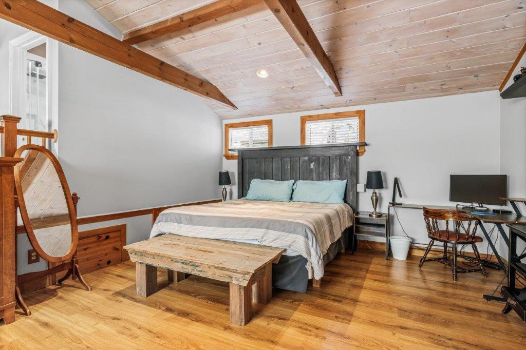 110 Kelley Road Hyannis, MA 02601 - Photo 14 of 30 a bedroom with a bed a desk and chair with the wooden floor