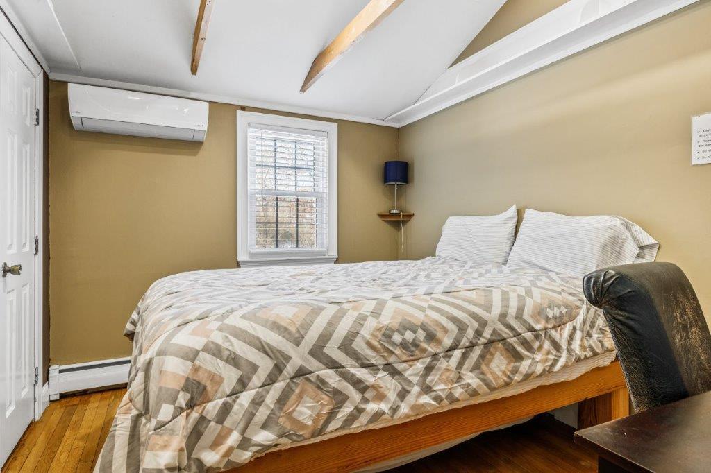 110 Kelley Road Hyannis, MA 02601 - Photo 18 of 30 a bedroom with a bed and wooden floor