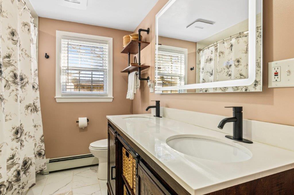 110 Kelley Road Hyannis, MA 02601 - Photo 22 of 30 a bathroom with a sink toilet and a window