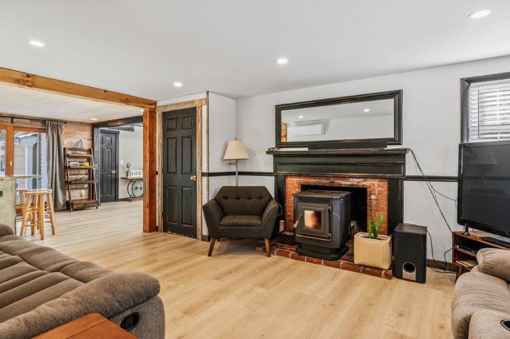 110 Kelley Road Hyannis, MA 02601 - Photo 4 of 30 a living room with furniture and a fireplace