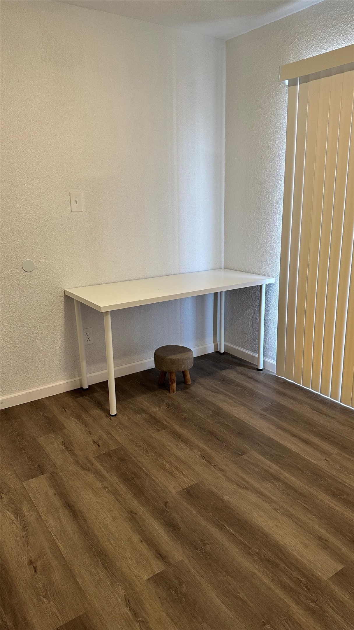 6200 Ranchester Drive, Unit 230 Houston, TX 77036 - Photo 16 of 31 a view of an empty room with wooden floor and a window