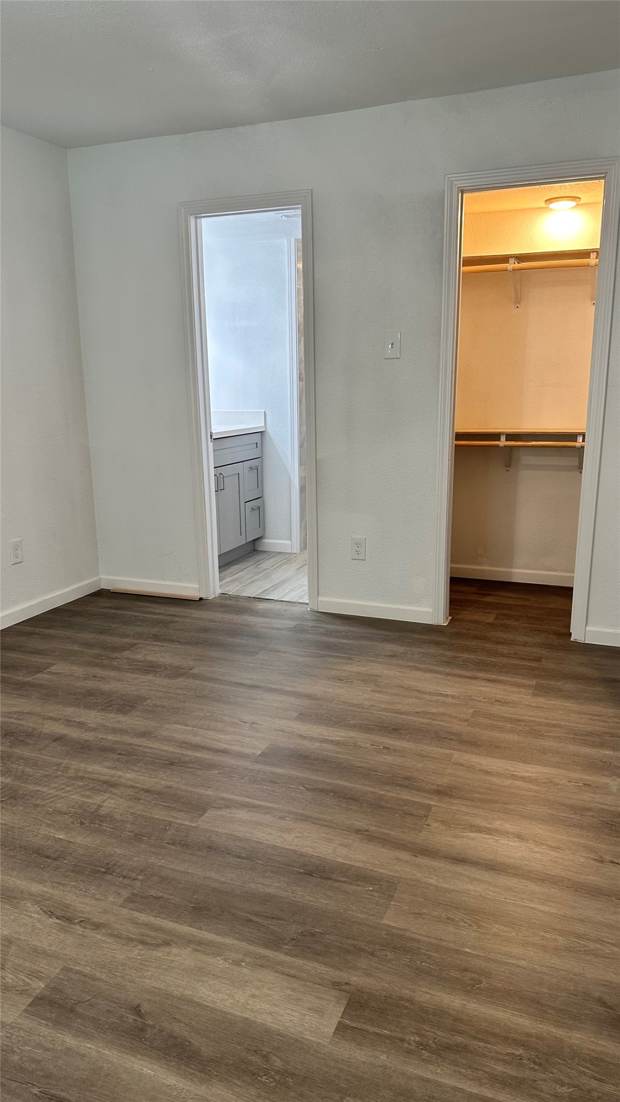 6200 Ranchester Drive, Unit 230 Houston, TX 77036 - Photo 21 of 31 a view of an empty room with wooden floor and a window