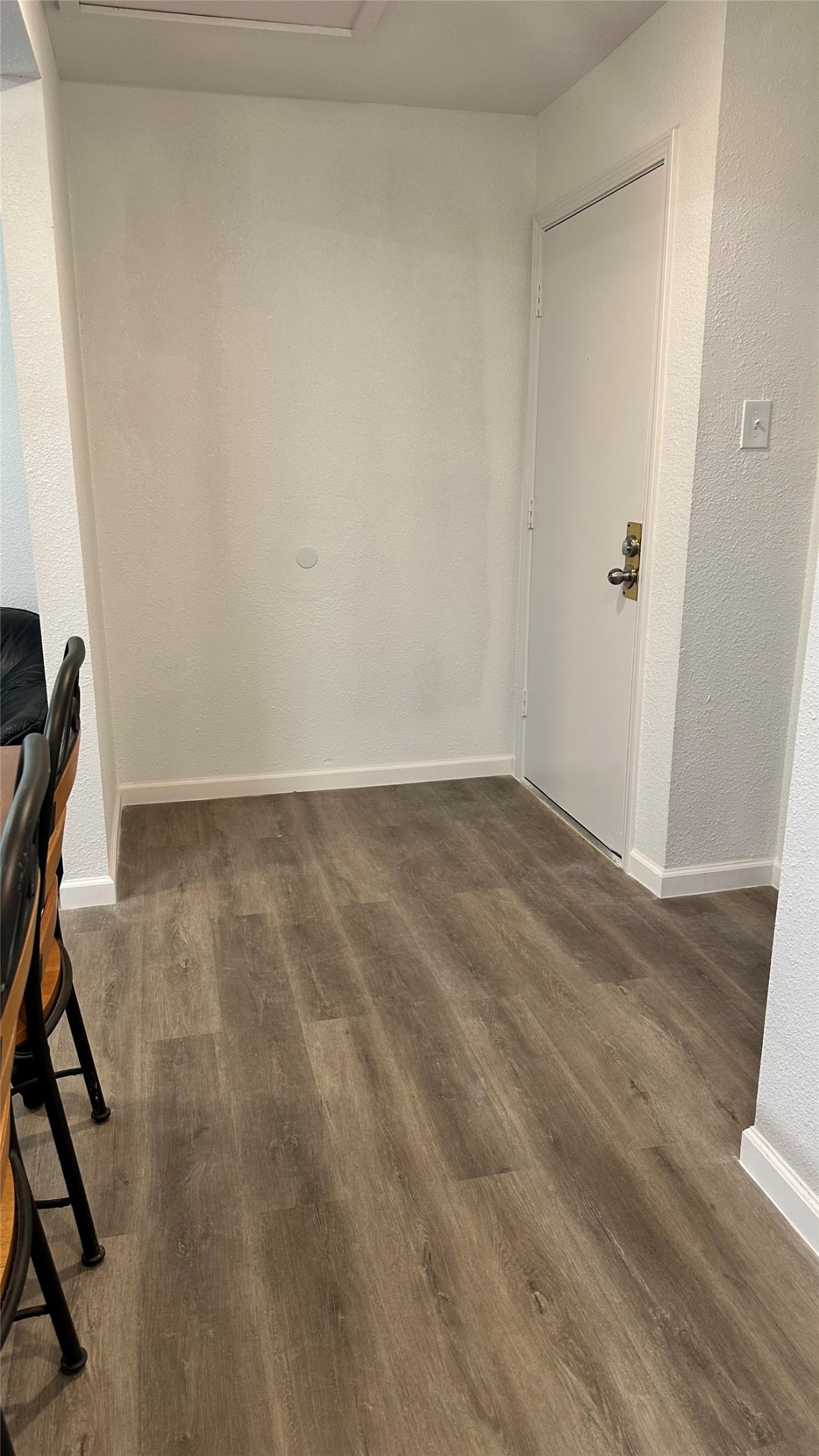 6200 Ranchester Drive, Unit 230 Houston, TX 77036 - Photo 24 of 31 an empty room with wooden floor and white walls