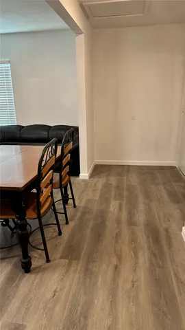 a view of an empty room and wooden floor