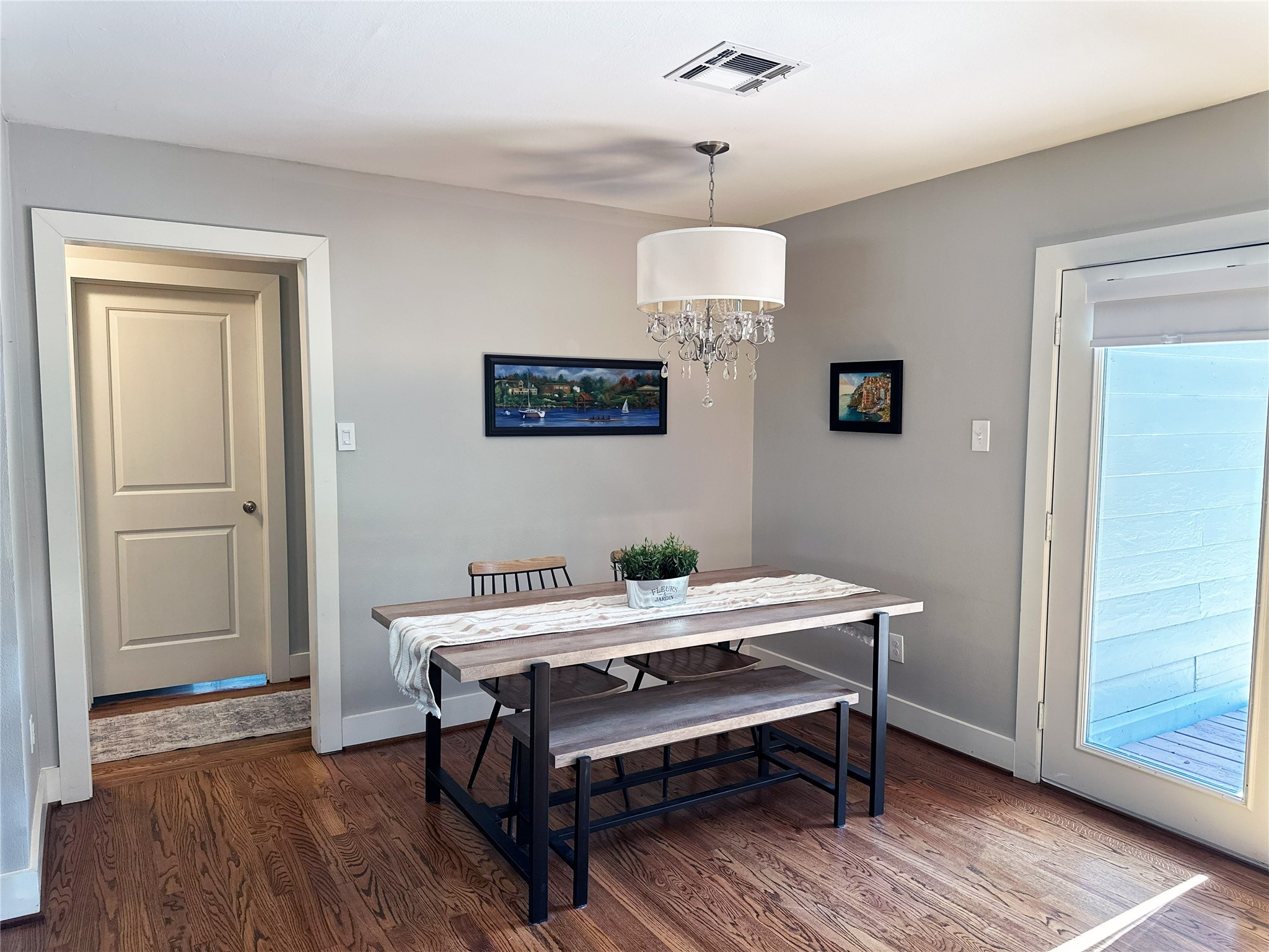 4821 Hummingbird Street Houston, TX 77035 - Photo 16 of 45 a room with chandelier fan and wooden floor