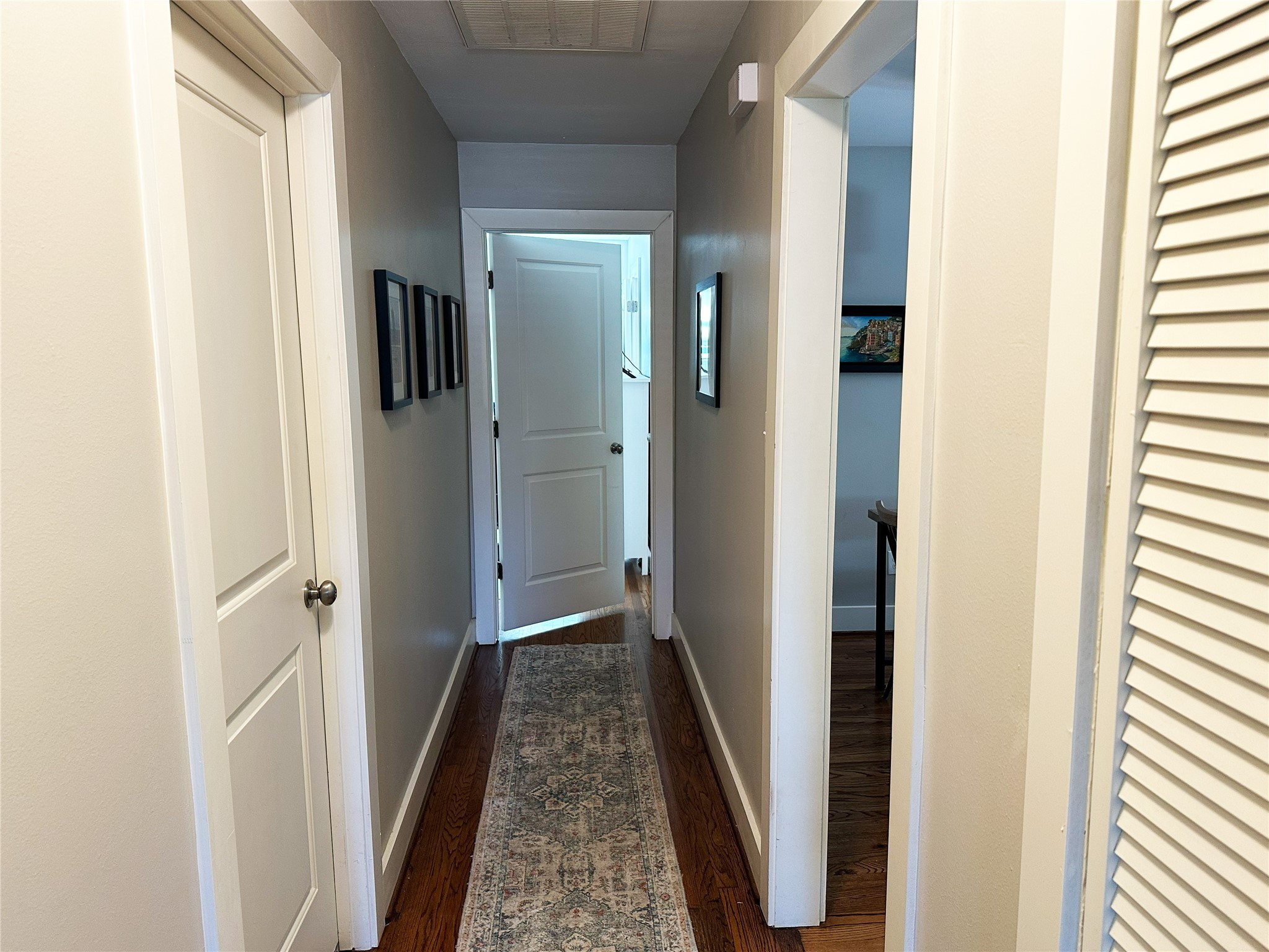4821 Hummingbird Street Houston, TX 77035 - Photo 24 of 45 a view of a hallway with wooden floor and staircase